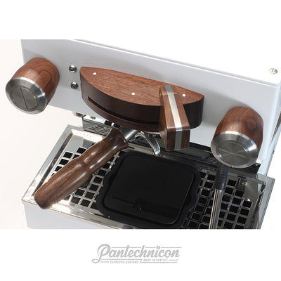 walnut and steel steam knobs installed on a white linea mini