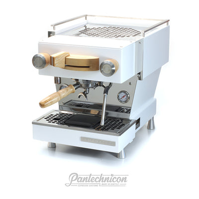 3/4 view of custom white linea mini with maple and stainless steel 