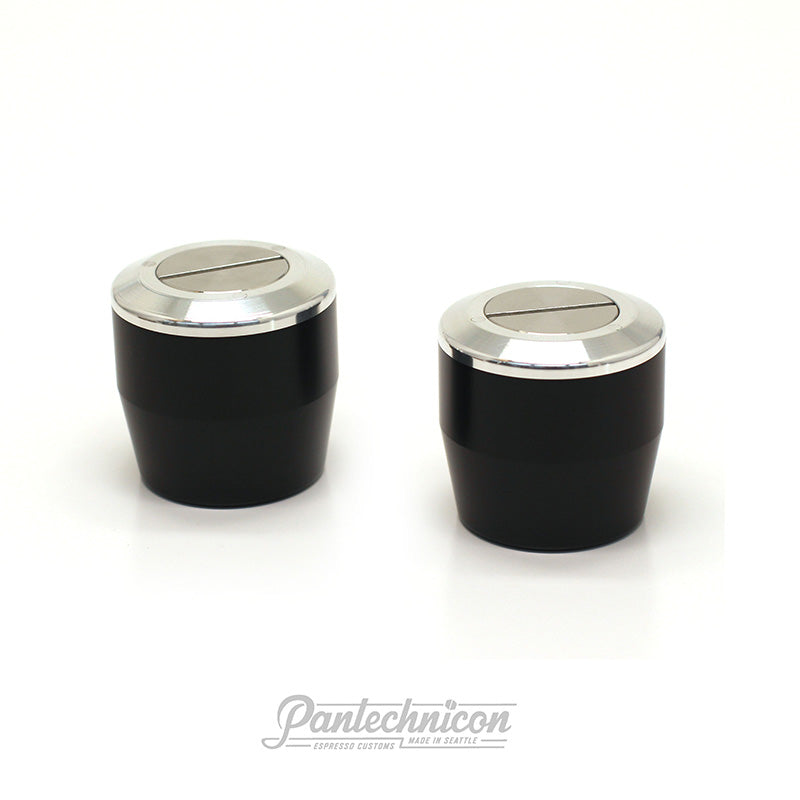 3/4 view of custom linea mini steam knobs in black and brushed steel