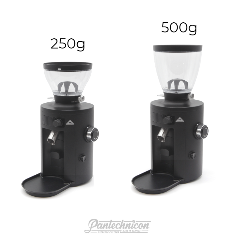 two x54 grinders side by side, one with short hopper one with tall hopper