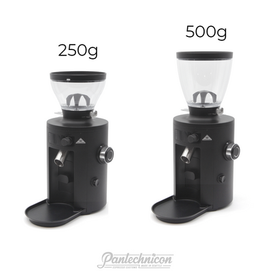 two x54 grinders side by side, one with short hopper one with tall hopper